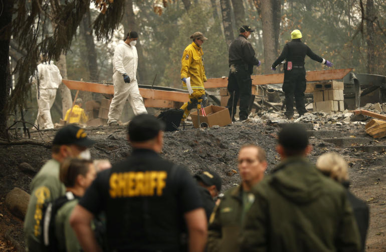 Investigators recover human remains at a home burned in the Camp Fire