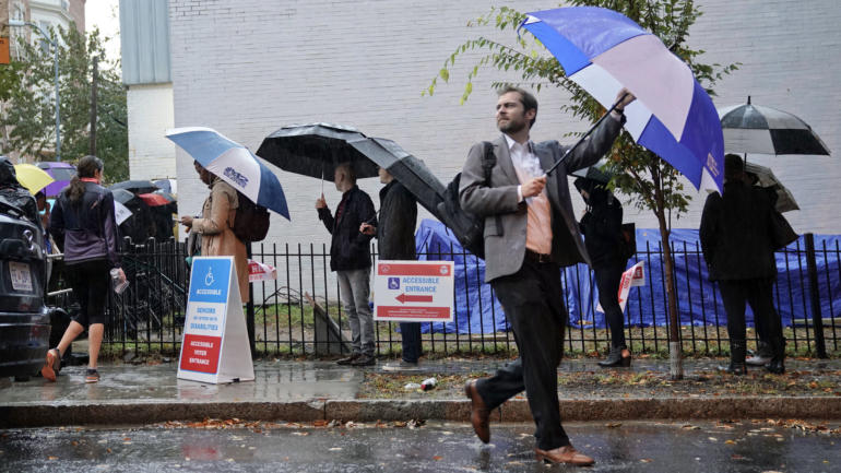 Voters line up in the rain