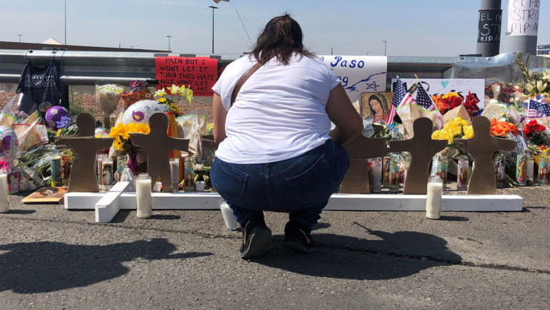 Mourners lay flowers at a shrine near Walmart in El Paso, Texas