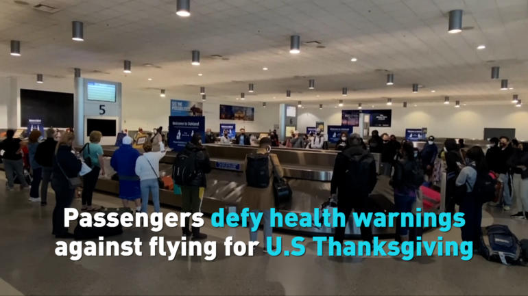 Passengers defy health warnings against flying for U.S Thanksgiving