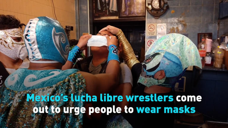 Mexico’s lucha libre wrestlers come out to urge people to wear masks