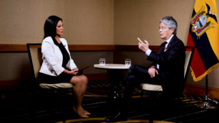 President Guillermo Lasso sitting face to face with Americas Now anchor Elaine Reyes