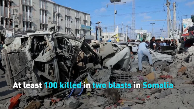 At least 100 killed in two blasts in Somalia