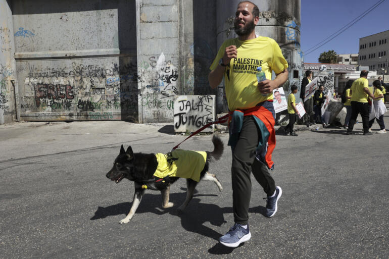 Organizers, unable to find a single course of 42 uninterrupted kilometers under Palestinian Authority control in the city, runners had to complete two laps of the same route.