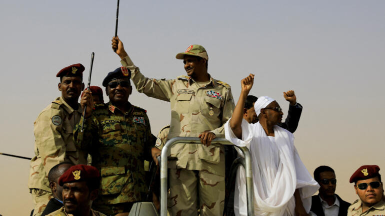 Lieutenant General Mohamed Hamdan Dagalo, deputy head of the military council and head of paramilitary Rapid Support Forces (RSF), greets his supporters as he arrives at a meeting in Aprag village, 60 kilometers away from Khartoum, Sudan, June 22, 2019. REUTERS/Umit Bektas