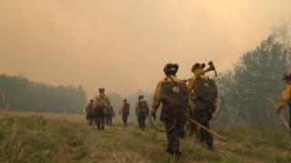 Firefighters battle through Canada’s worst fire season on record