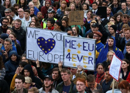 Pro-Europe demonstrators hold up signs in London