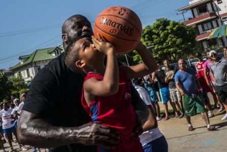 NBA Hall of famer Shaquille O'Neal, plays with a youngster during a clinic with young players in Havana.