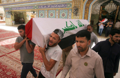 Mourners carry coffin