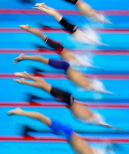 group of swimmers diving