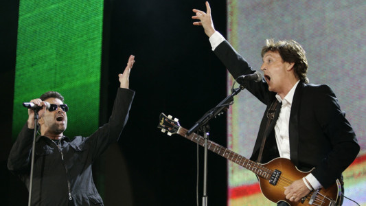 In this July 2, 2005, file photo, George Michael, left, and Paul McCartney, right, perform during the Live 8 concert in Hyde Park, London. (AP Photo/Lefteris Pitarakis, File)