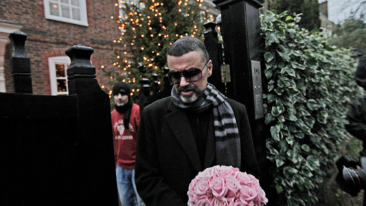 In this Friday, Dec. 23, 2011 file photo, British singer George Michael leaves his house in north London, after recovering from a life-threatening bout with pneumonia that kept him in a Vienna hospital for a month. (AP Photo/Lefteris Pitarakis,File)