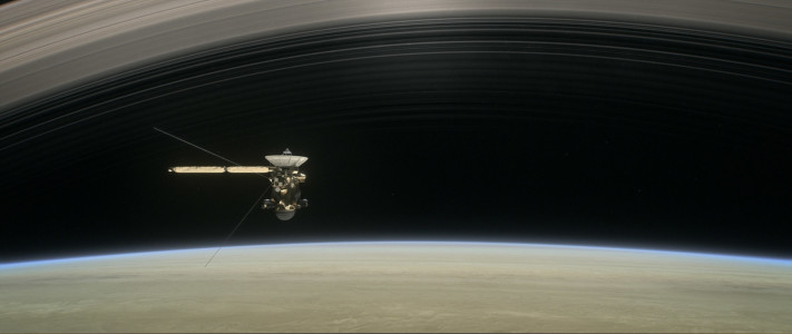 This image made available by NASA in April 2017 shows a still from the short film "Cassini's Grand Finale," with the spacecraft diving between Saturn and the planet's innermost ring. (NASA/JPL-Caltech via AP) Cassini orbits Saturn