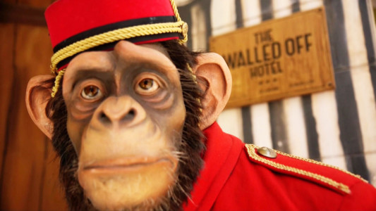 A stoic bellhop greets at the entrance to the Wall Hotel. (ART: Banksy / PHOTO: Gil Somekh) Banksy's Wall Hotel