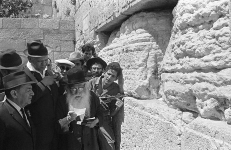 Israeli soldiers and ultra-Orthodox Jews praying at the Western Wall, the holiest site where Jews can pray, in the Old City of Jerusalem during the Six-Day Arab-Israeli war on June 9, 1967. (FILE / ISRAELI GOVERNMENT PRESS OFFICE)