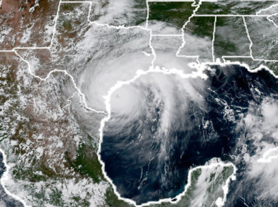 This National Oceanic and Atmospheric Administration satellite image taken on August 25, 2017, shows Hurricane Harvey (L) approaching the coast of Texas.
/ AFP PHOTO / NASA/NOAA / HO Hurricane Harvey NOAA Satellite
