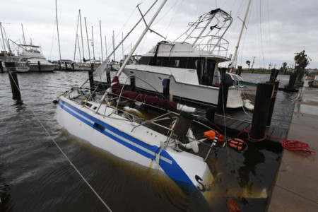 A sunken boar at Rockport Harbor after heavy damage when Hurricane Harvey hit Rockport, Texas on August 26, 2017.
Hurricane Harvey left a trail of devastation Saturday after the most powerful storm to hit the US mainland in over a decade slammed into Texas, destroying homes, severing power supplies and forcing tens of thousands of residents to flee. / AFP PHOTO / MARK RALSTON Hurricane Harvey Slams Into Texas Gulf Coast