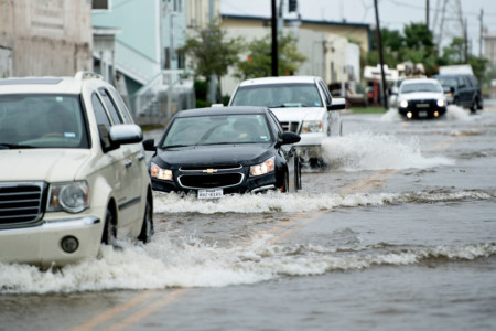Vehicles drive through a flooded street as the effects of Hurricane Henry are seen August 26, 2017 in Galveston, Texas.
Hurricane Harvey left a trail of devastation Saturday after the most powerful storm to hit the US mainland in over a decade slammed into Texas, destroying homes, severing power supplies and forcing tens of thousands of residents to flee. / AFP PHOTO / Brendan Smialowski Hurricane Harvey Slams Into Texas Gulf Coast