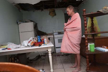 ROCKPORT, TX - AUGUST 26: Terry Smith stands in the apartment that had its ceiling collapse when Hurricane Harvey hit on August 26, 2017 in Rockport, Texas. Joe Raedle/Getty Images/AFP Hurricane Harvey Slams Into Texas Gulf Coast