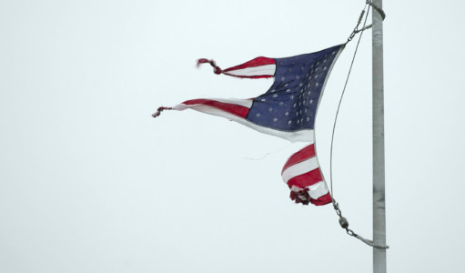 A tattered U.S. flag whips in the wind in Geronimo, Texas, during Hurricane Harvey on Saturday August 26, 2017. (Jay Janner/Austin American-Statesman via AP)