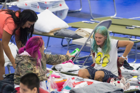Hurricane Harvey Evacuees rest at the Delco Center in East Austin on August 29, 2017, where 220 evacuees are currently being hosted.
Floodwaters have breached a levee south of the city of Houston, officials said Tuesday, urging residents to leave the area immediately. (AFP PHOTO / SUZANNE CORDEIRO)