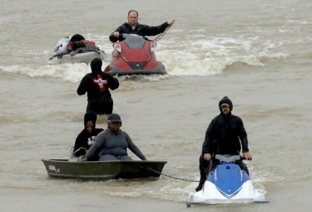 HOUSTON, TX - AUGUST 29: Residents are evacuated from their homes after severe flooding following Hurricane Harvey in north Houston August 29, 2017 in Houston, Texas. (Win McNamee/Getty Images/AFP)