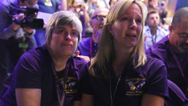 Cassini science team members Nora Alonge (R) and Jo Pitesky (L) react as the final loss of signal from the Cassini spacecraft is confirmed, indicating Cassini's destruction in Saturn's atmosphere and the end of Cassini's 20-year mission. (AFP PHOTO / Robyn Beck)