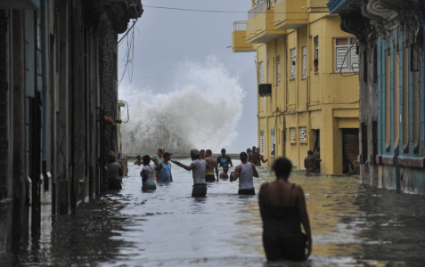 Cubans wade through a flooded street in Havana, on September 10, 2017.
Deadly Hurricane Irma battered central Cuba on Saturday, knocking down power lines, uprooting trees and ripping the roofs off homes as it headed towards Florida. Authorities said they had evacuated more than a million people as a precaution, including about 4,000 in the capital.
(AFP PHOTO / YAMIL LAGE)