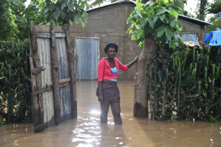 Marie Charlotte walks through water near her house that was flooded, in Malfeti, in the city of Fort Liverte, in the north east of Haiti, on September 8, 2017, during the passage of Hurricane Irma. (AFP PHOTO / HECTOR RETAMAL)
