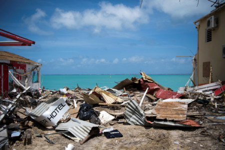 A picture taken on September 11, 2017 shows the rubbles from collapsed buildings in Grand-Case, on the French Caribbean island of Saint-Martin after it was hit by Hurricane Irma. / AFP PHOTO / Martin BUREAU