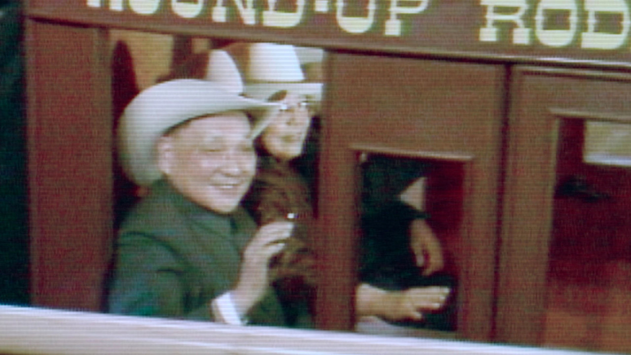 Deng Xiaoping gets a hero’s welcome at a Houston, Texas, rodeo; and returns the gesture by donning the traditional cowboy hat he is given.