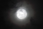 The 'supermoon' is pictured rising over Asuncion on January 1, 2018. (AFP PHOTO / NORBERTO DUARTE)