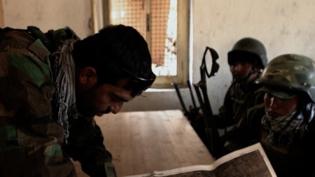 The Company’s Commander goes over the map before a dangerous mission to a mine-filled area.