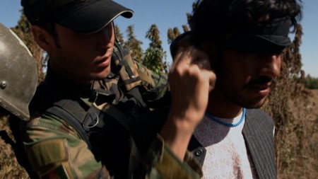 When his story doesn’t add up, a young man is blindfolded by the ANA and taken into custody.