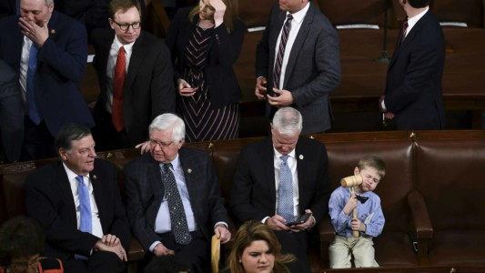 A little boy plays with a gavel as lawmakers and their children and grandchildren arrive before the start of the 116th Congress and swearing-in ceremony on the floor of the US House of Representatives at the US Capitol on January 3, 2019 in Washington,DC. (Photo by Brendan Smialowski / AFP)