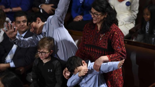 Member-elect Rashida Tlaib(D-MI) plays with her children during the 116th Congress and swearing-in ceremony on the floor of the US House of Representatives at the US Capitol on January 3, 2019 in Washington,DC. (Photo by Brendan Smialowski / AFP)
