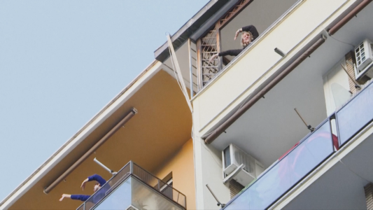 Italians thanking medical workers for their work by singing and dancing on balconies.