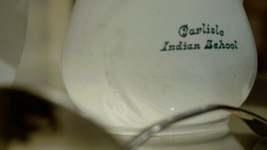 An old ceramic pot with the name of the Carlisle Indian School engraved.