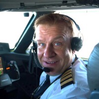 British billionaire Hamish Harding, who is said to be among the passengers onboard the submarine that went missing on trip to the Titanic wreckage is seen in this handout picture taken in flight, July 2019. (Courtesy of Jannicke Mikkelsen/via REUTERS)